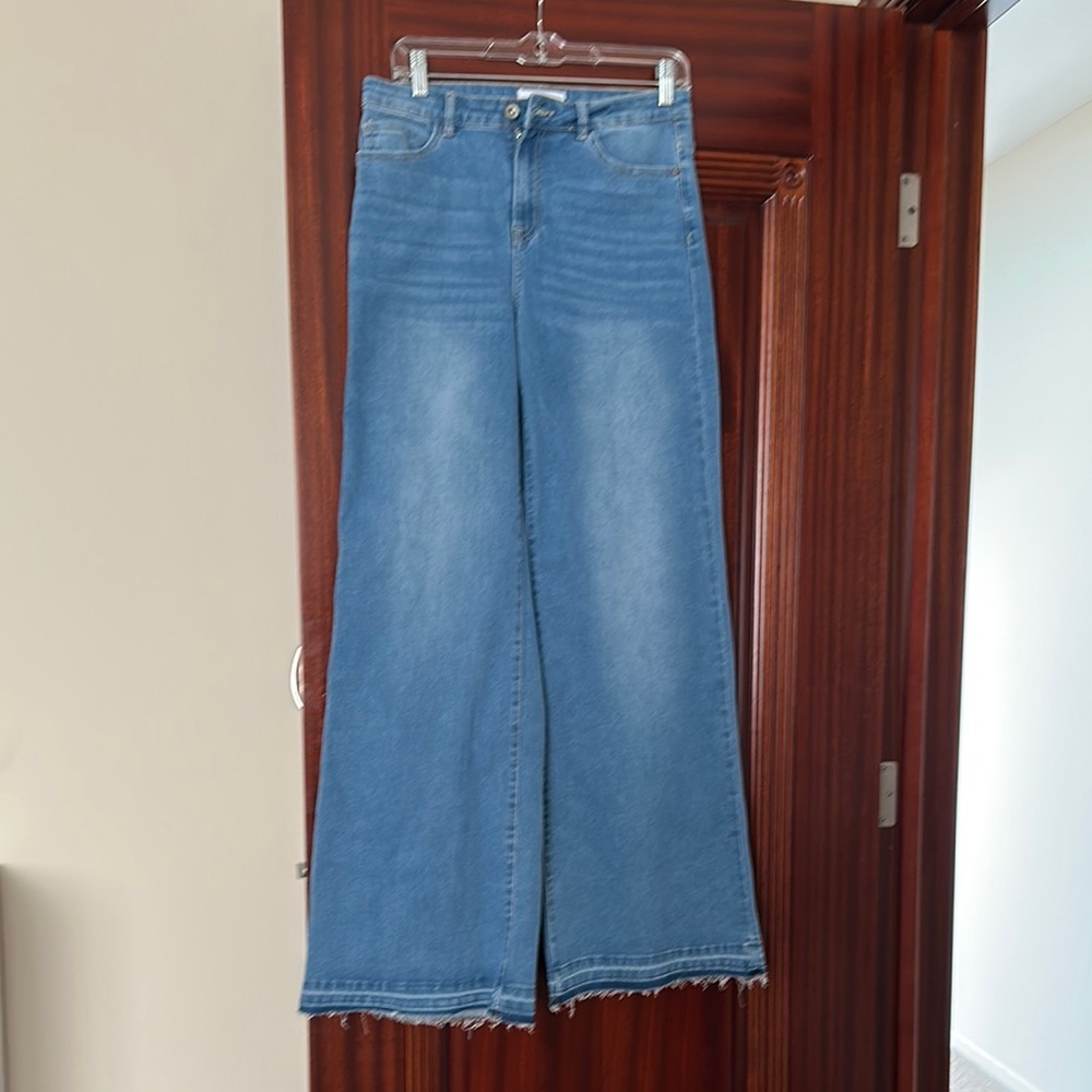Blue Flare Jeans with Raw Hem and 70s-Inspired Style